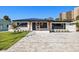 Charming home featuring modern upgrades, a new roof, and a spacious paver driveway at 864 Mandalay Ave, Clearwater Beach, FL 33767