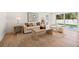 Modern living room with stylish furniture, neutral tones, and seamless access to a pool view through sliding glass doors at 864 Mandalay Ave, Clearwater Beach, FL 33767