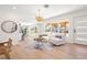 Airy open-concept living area featuring stylish decor, hardwood floors, and ample natural light at 864 Mandalay Ave, Clearwater Beach, FL 33767