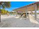 A covered playground situated on a sandy beach, perfect for Gathering fun and recreation at 864 Mandalay Ave, Clearwater Beach, FL 33767