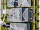 An aerial view of the home showcasing the roof, pool, backyard, and driveway at 8720 Drummer Plank Dr, Wesley Chapel, FL 33545