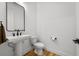 Bathroom featuring pedestal sink, modern fixtures, and tile floors at 8720 Drummer Plank Dr, Wesley Chapel, FL 33545