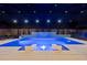 Inviting screened pool with a waterfall feature, sun shelves, and lounge chairs for relaxation at 8720 Drummer Plank Dr, Wesley Chapel, FL 33545