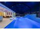 Gorgeous screened pool with waterfall feature, sun shelves, and outdoor lounge area for ultimate relaxation at 8720 Drummer Plank Dr, Wesley Chapel, FL 33545