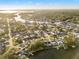 Waterfront community aerial view, showcasing the serene canal and beautiful neighborhood homes at 8801 Sunlit Cove Ne Dr, St Petersburg, FL 33702