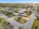 Well-maintained single-story home with a circular driveway and manicured front yard at 8801 Sunlit Cove Ne Dr, St Petersburg, FL 33702