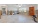 Spacious living room with natural light from a window, offering an inviting space at 8801 Sunlit Cove Ne Dr, St Petersburg, FL 33702