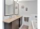 Bathroom featuring a soaking tub and a double sink vanity at 912 Channelside Dr # 2501, Tampa, FL 33602