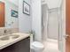 Modern bathroom with glass enclosed shower and granite vanity at 912 Channelside Dr # 2501, Tampa, FL 33602