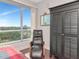 Bedroom with relaxing chair, large window and dark wood accents at 912 Channelside Dr # 2501, Tampa, FL 33602