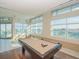 The game room includes a stylish billiards table and expansive views from multiple windows at 912 Channelside Dr # 2501, Tampa, FL 33602