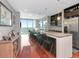 Modern kitchen with stone countertops, stainless appliances, and barstool seating at 912 Channelside Dr # 2501, Tampa, FL 33602