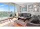 Comfortable living room featuring patio access, hardwood floors, and picture frame molding at 912 Channelside Dr # 2501, Tampa, FL 33602
