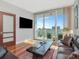 Living room features hardwood floors, neutral walls, and a sliding door to a balcony at 912 Channelside Dr # 2501, Tampa, FL 33602