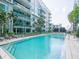 The large in-ground pool provides an oasis with comfortable lounge chairs for relaxing by the water at 912 Channelside Dr # 2501, Tampa, FL 33602