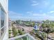 Expansive city view from a high vantage point, showcasing palm-lined streets and a clear blue sky at 912 Channelside Dr # 2501, Tampa, FL 33602