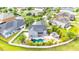 Aerial view of property featuring a pool, outdoor kitchen, manicured lawn and privacy fence at 9607 Orange Jasmine Way, Tampa, FL 33647