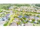 Aerial view of the property within a lush, green neighborhood, showcasing the location, boundary lines, and landscape at 9607 Orange Jasmine Way, Tampa, FL 33647