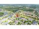 An aerial shot points to a lovely neighborhood property, enhanced by nearby lakes and surrounding greenery at 9607 Orange Jasmine Way, Tampa, FL 33647