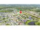 Aerial view shows the location of the property in the neighborhood, complete with mature trees and manicured lawns at 9607 Orange Jasmine Way, Tampa, FL 33647