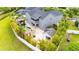 Stunning backyard with a rock waterfall pool, beautiful landscaping, and a covered outdoor kitchen area at 9607 Orange Jasmine Way, Tampa, FL 33647
