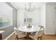Intimate dining area showcasing a modern table set and window with natural light at 9607 Orange Jasmine Way, Tampa, FL 33647