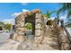 Unique pool area with a rock grotto, stairs to a waterslide, and access to the pool area at 9607 Orange Jasmine Way, Tampa, FL 33647
