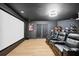 Home theater room boasts large screen, comfy seating and football helmet display at 9607 Orange Jasmine Way, Tampa, FL 33647