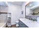 Bathroom featuring tile backsplash, modern fixtures, and vanity at 910 Black Knight Dr, Valrico, FL 33594