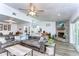 Spacious living room with a stone fireplace, open layout, and stylish decor throughout at 910 Black Knight Dr, Valrico, FL 33594