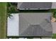Bird's eye view of grey roof, patio, and the well-kept landscaping of the backyard at 10008 Celtic Ash Dr, Ruskin, FL 33573