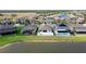 Aerial view of homes with pools and lakefront access in a residential neighborhood at 10008 Celtic Ash Dr, Ruskin, FL 33573