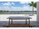 Back patio features a view of the lake, a hammock, and a picnic table at 10008 Celtic Ash Dr, Ruskin, FL 33573