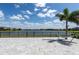 Back patio features a view of the lake and a hammock at 10008 Celtic Ash Dr, Ruskin, FL 33573
