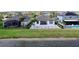 Backyard featuring a patio and view of the lake, enclosed with a black fence at 10008 Celtic Ash Dr, Ruskin, FL 33573
