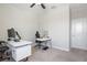 Bedroom setup as an office with modern white desk and a lake view at 10008 Celtic Ash Dr, Ruskin, FL 33573