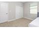 Bedroom with a bedside table, closet, and a window with blinds at 10008 Celtic Ash Dr, Ruskin, FL 33573