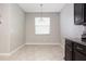 Bright breakfast nook with window, tile flooring, and dark wood cabinetry at 10008 Celtic Ash Dr, Ruskin, FL 33573