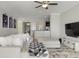 A bright and inviting living room with a plush white sofa and open access to the dining and kitchen areas at 10008 Celtic Ash Dr, Ruskin, FL 33573