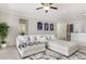 Bright living room offers comfortable seating and an open layout connecting to the kitchen and other living spaces at 10008 Celtic Ash Dr, Ruskin, FL 33573
