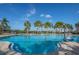 Sparkling community pool with accessible chair lift surrounded by lounge chairs, perfect for relaxation and socializing at 10008 Celtic Ash Dr, Ruskin, FL 33573