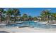 Stunning community pool surrounded by lush landscaping and lounge chairs, perfect for relaxation and socializing at 10008 Celtic Ash Dr, Ruskin, FL 33573