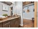 Modern bathroom features granite counters, cabinets, an electric mirror and rustic wood floors at 101 N 12Th St # 206, Tampa, FL 33602