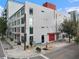 Modern building featuring a white exterior and a red accent on the top and bottom at 101 N 12Th St # 206, Tampa, FL 33602