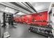 Fully equipped fitness center with weights, machines, and a red accent wall at 101 N 12Th St # 206, Tampa, FL 33602