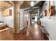 Hallway featuring hardwood floors, concrete pillars, and a bench to create a rustic and industrial atmosphere at 101 N 12Th St # 206, Tampa, FL 33602