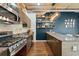 Modern kitchen with stainless steel appliances, granite countertops, a backsplash, and a wooden island at 101 N 12Th St # 206, Tampa, FL 33602