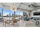 Bright open-concept living room with concrete ceilings, modern lighting, and city views at 101 N 12Th St # 206, Tampa, FL 33602