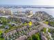 High aerial view of community with manicured landscaping, and townhome exteriors at 11260 Kapok Grand Cir, Madeira Beach, FL 33708