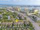 Aerial view of the townhome exteriors, lawns, parking, and proximity to coastal areas at 11260 Kapok Grand Cir, Madeira Beach, FL 33708